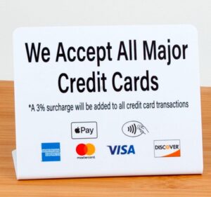 A photo of a credit card processing sign